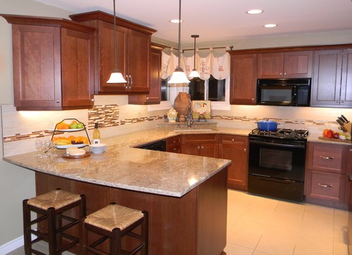 Cambria Berkeley Perimeter Countertop with Cherry Cabinets and Glass Field Tile and Porcelain Flooring